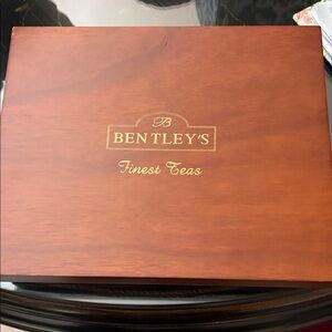 Bentleys 12 square wood tea box with lid lined in red velvet with teas.
